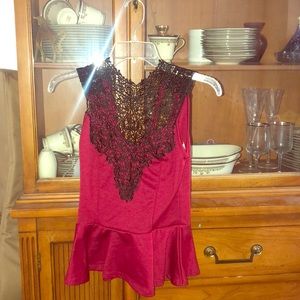 A black and red peplum top